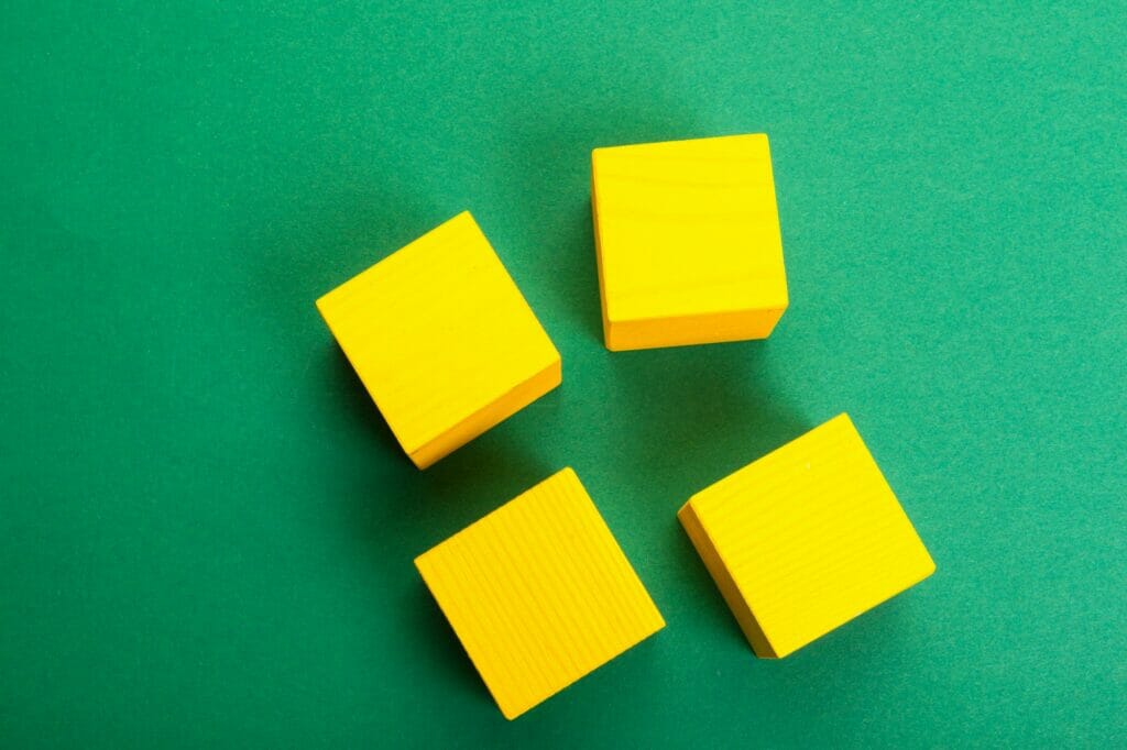 wood cube building blocks on the table. top view