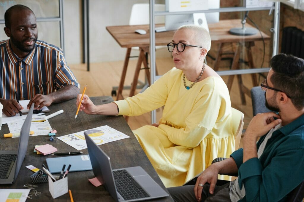 Business leader talking to her employees