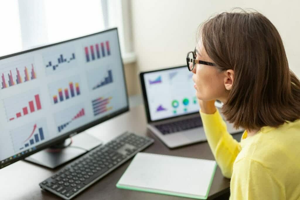 Caucasian advisor financial business analytics woman with data dashboard graphs