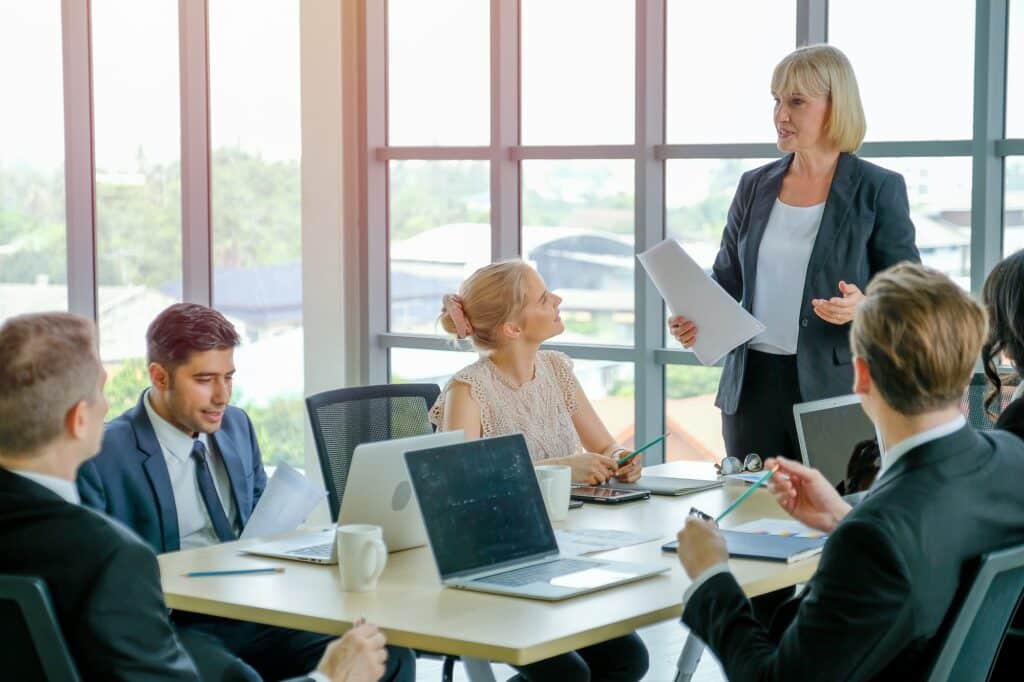 Manager woman or leader of business teams discuss with detail in the document with her team