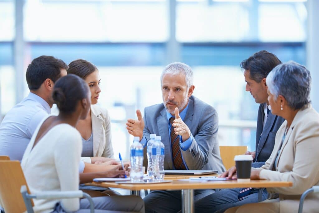 Serious strategizing. A cropped shot of a diverse group of businesspeople having a meeting.