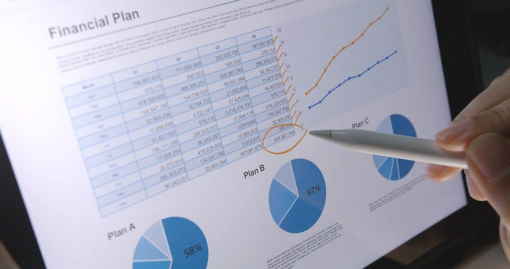 Close-up hand use pen write check growth data number on touch screen