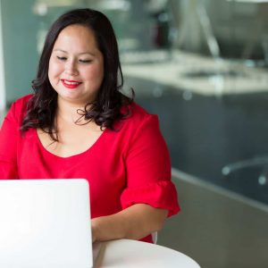 selective focus photography of woman using laptop computer